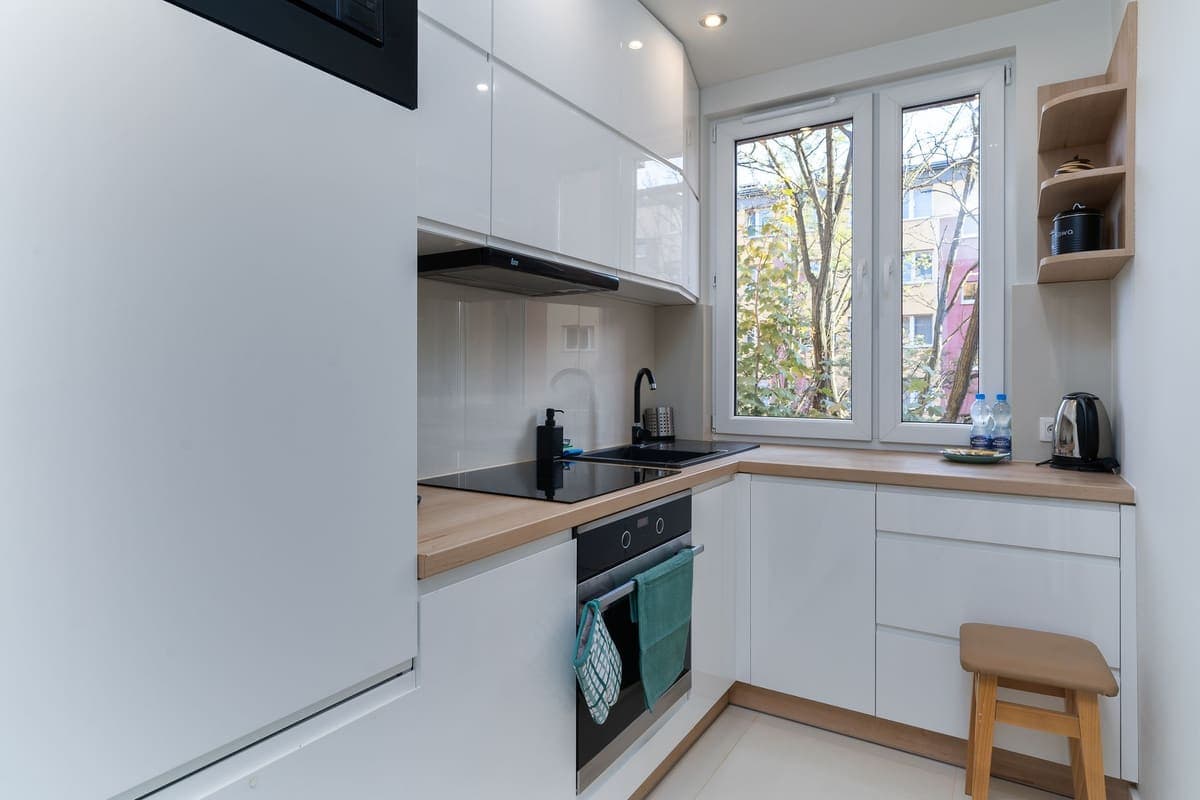 Modern minimalist white apartment kitchen