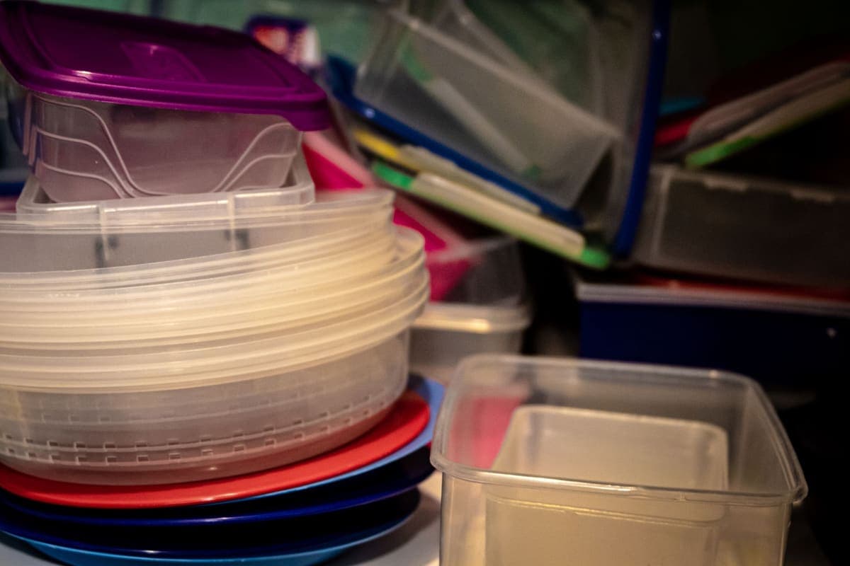 Stack of plastic lids and containers
