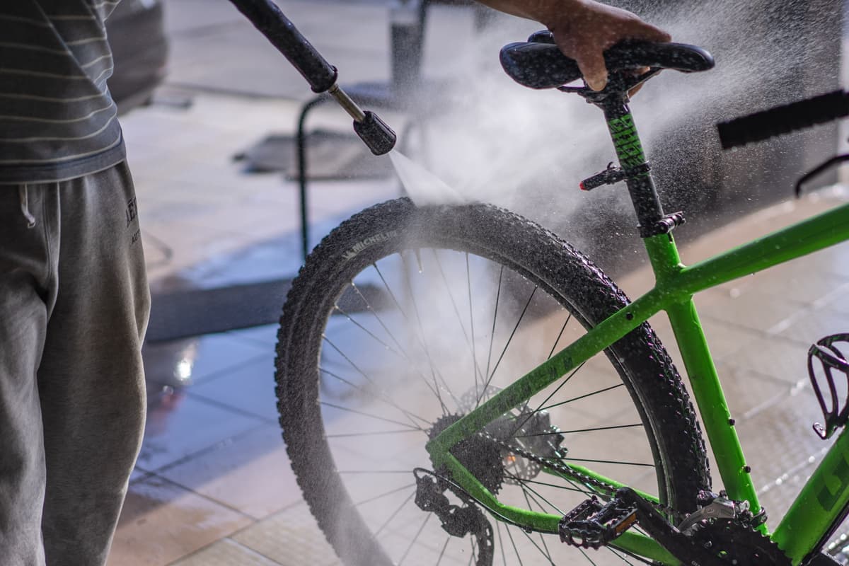 Hose washing down an outdoor paved area