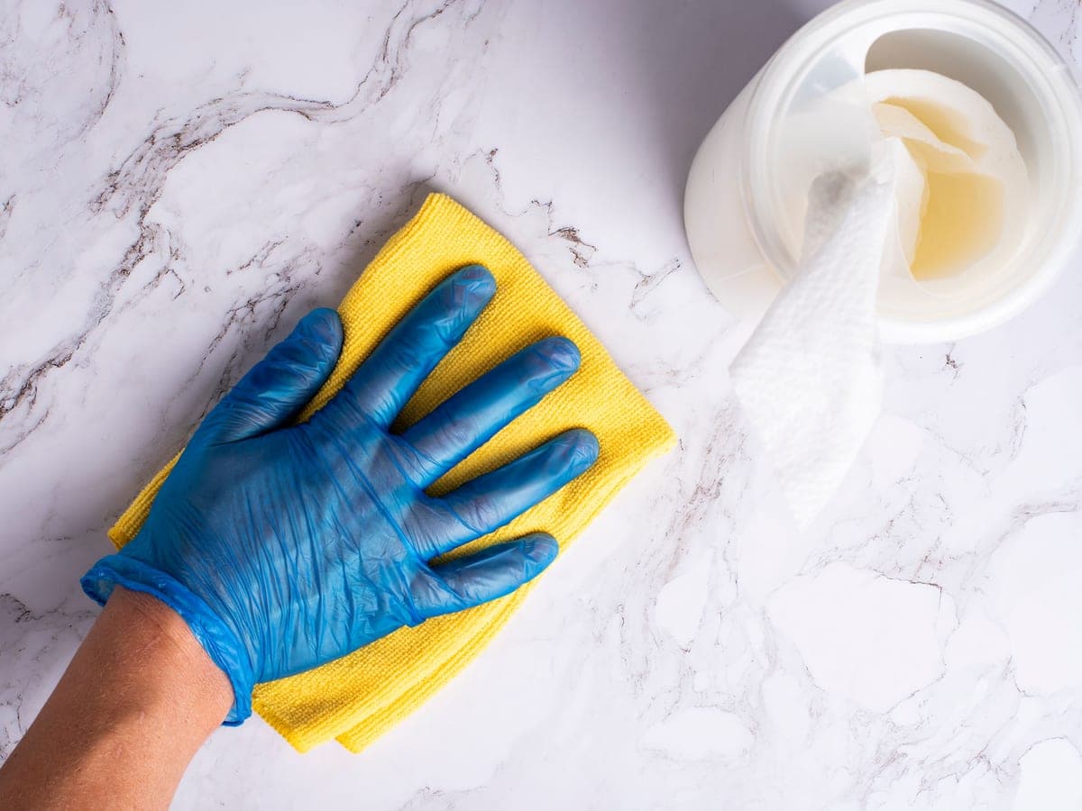 Clean kitchen counter being wiped down