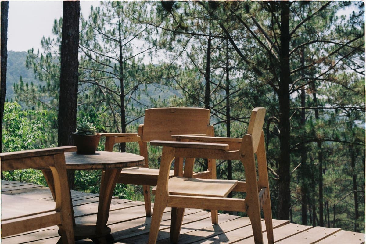 Wooden deck with patio chairs and a table