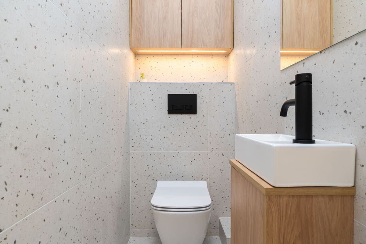 Compact modern bathroom with white terrazzo tile