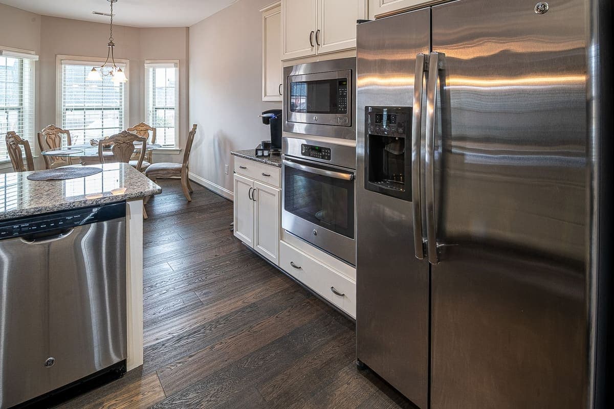 An empty modern kitchen with stainless appliances