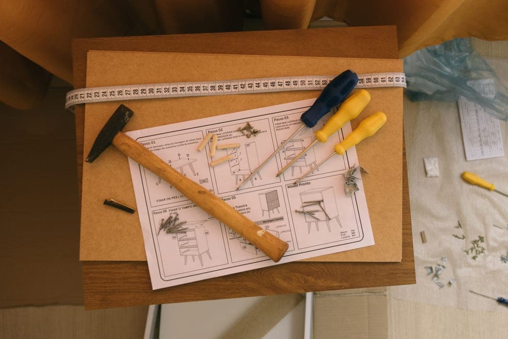Wire-frame double pull-out trash can kit for a cabinet