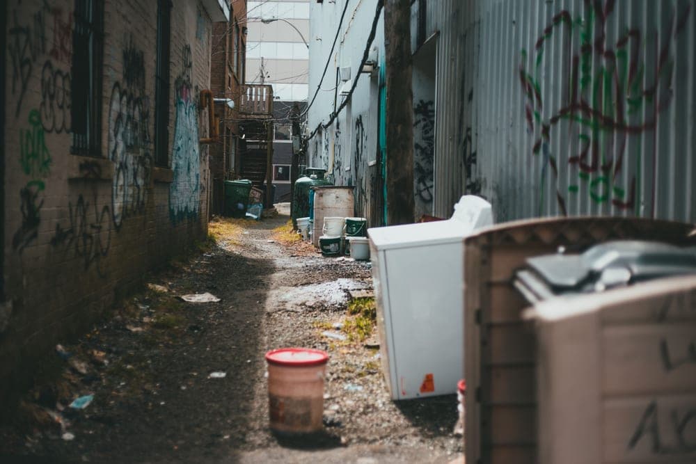 Narrow rectangular metal step trash can